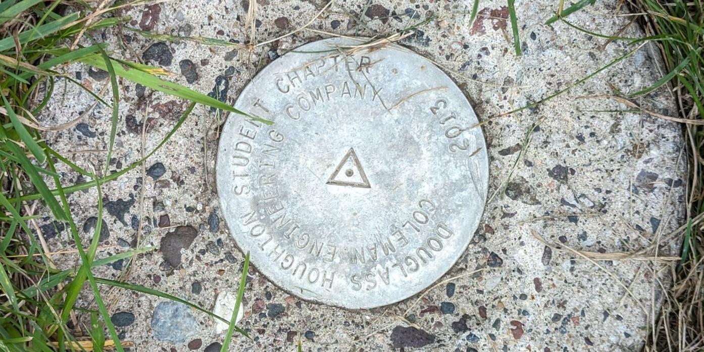Survey mark on the Michigan Tech campus